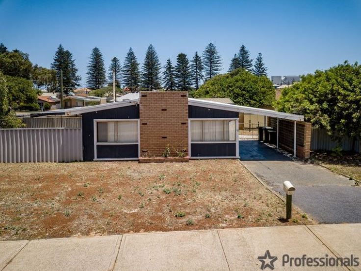 Brick and weatherboard house with side driveway and carport